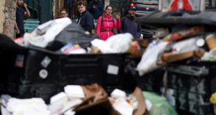 A view of overflowing bins in the Grassmarket area of Edinburgh where cleansing workers from the City of Edinburgh Council are on the fourth day of eleven of strike action, in Scotland, Wednesday, Aug. 24, 2022.