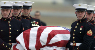 The body of CIA officer Johnny "Mike" Spann is carried by a Marine honor guard from an Air Force aircraft on Dec. 2, 2001 at Andrews Air Force Base