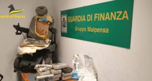 This picture made available Friday, Sep. 2, 2022, by the Italian Financial Police shows the motorized wheelchair used by a man who tried to sniff some 13 kilos (nearly 30 pounds) of cocaine, foreground, at Milan airport, northern Italy.