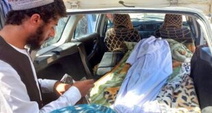 Covered body of a girl lies in the back of a vehicle after she was killed by unexploded shell in Helmand province, southern Afghanistan, Saturday, Sept. 3, 2022. 