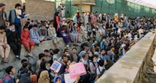 Crowds of people wait outside the airport in Kabul, Afghanistan, Aug. 25, 2021, in this photo obtained from social media. 