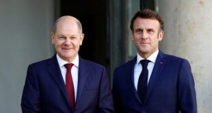 French President Emmanuel Macron welcomes German Chancellor Olaf Scholz to the Elysee Palace in Paris, Oct. 26, 2022.