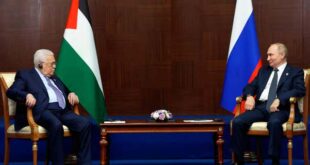 Russian President Vladimir Putin (right) and Palestinian President Mahmoud Abbas speak at a conference, in Astana, Kazakhstan, on Oct. 13, 2022.