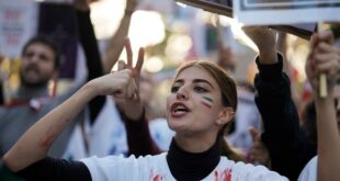 A woman shouts during a protest against the Iranian regime, in Berlin, Germany, Saturday, Oct. 22, 2022, following the death of Mahsa Amini in the custody of the Islamic republic's notorious "morality police."