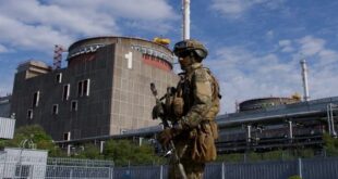 TOPSHOT - A Russian serviceman patrols the territory of the Zaporizhzhia Nuclear Power Station in Energodar on May 1, 2022. - The Zaporizhzhia Nuclear Power Station in southeastern Ukraine is the largest nuclear power plant in Europe and among the 10 largest in the world. 