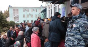 People arrived from Kherson wait for further evacuation into the depths of Russia at the Dzhankoi's railway station in Crimea on Oct. 21, 2022.