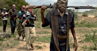 Al-Shabaab fighters seen walking along a trail in Somalia.